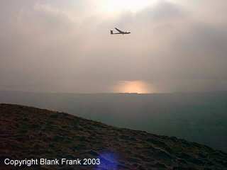 a glider looking towards Loch Leven through the mist (6k)